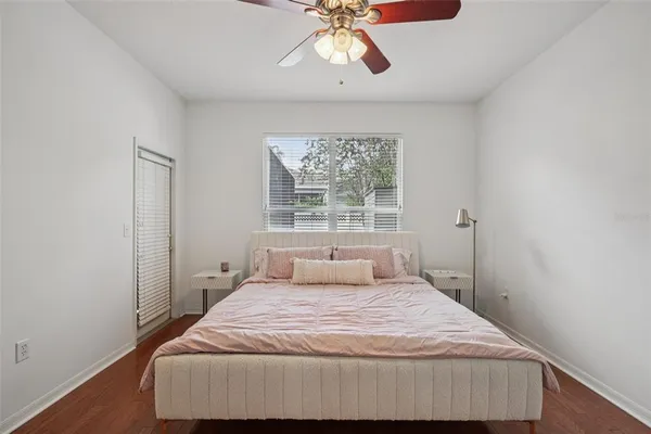 a bedroom with a bed and window