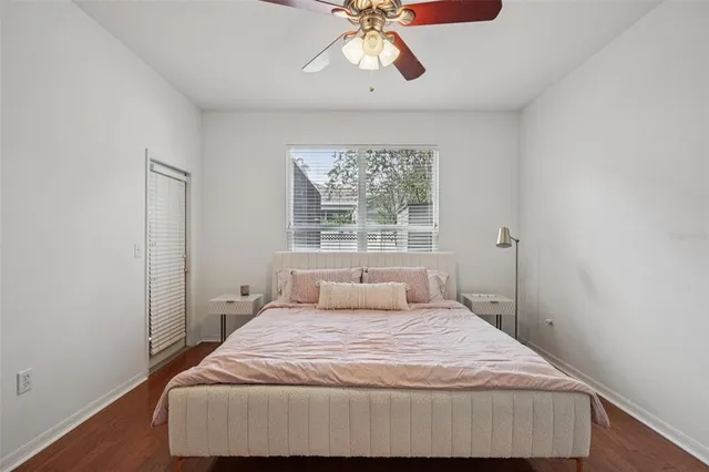 a bedroom with a bed and window