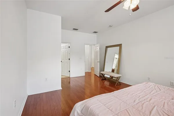 a bedroom with bed and window