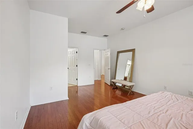 a bedroom with bed and window