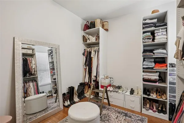 a bathroom with a toilet a sink and a closet