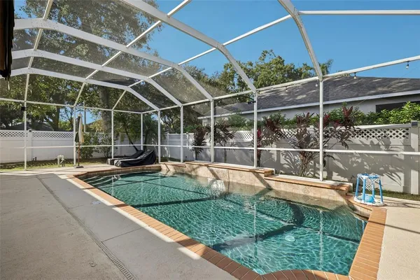 a view of a backyard with table and chairs