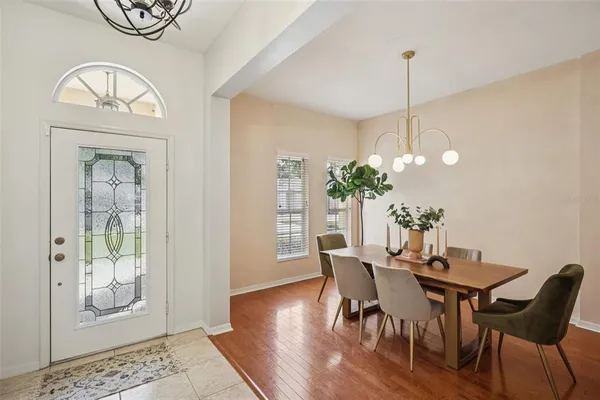 a view of a dining room with furniture window and wooden floor