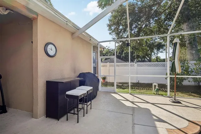 a backyard of a house with table and chairs