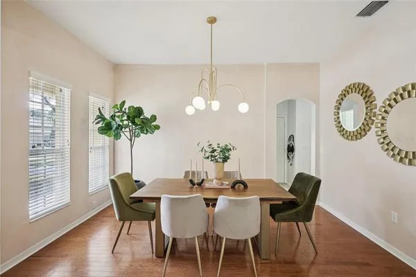 a dining room with furniture and window