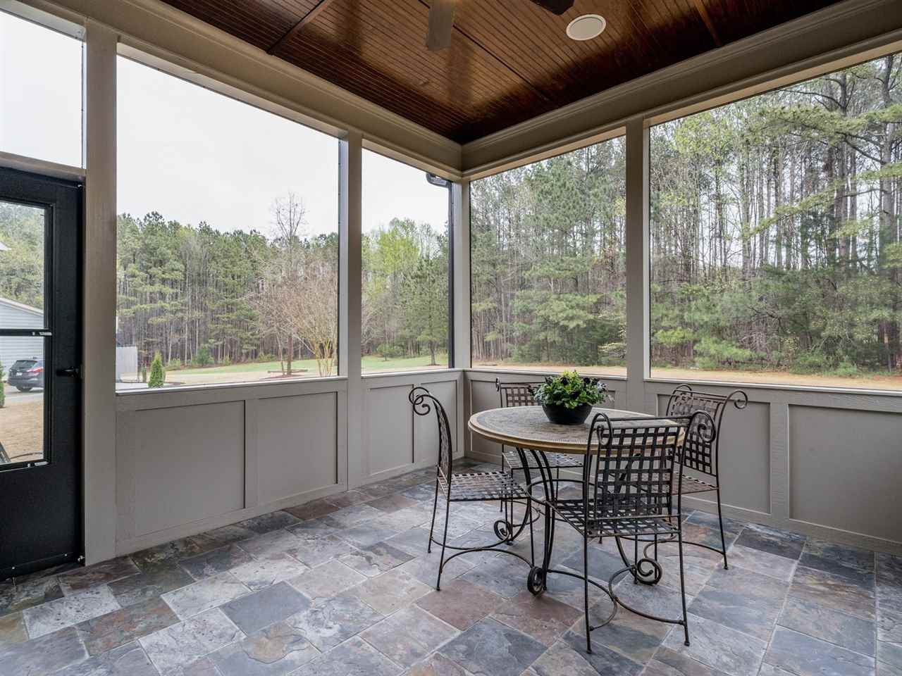 3316 Bryant Falls Court Raleigh, NC 27613 - Photo 27 of 30 Vaulted ceiling, ceiling fans and slate tile floor Screened Porch