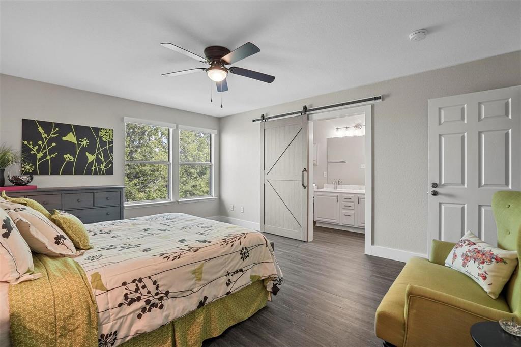 5113 Mountain Spring Trail Fort Worth, TX 76123 - Photo 26 of 35 a bedroom with a bed and wooden floor