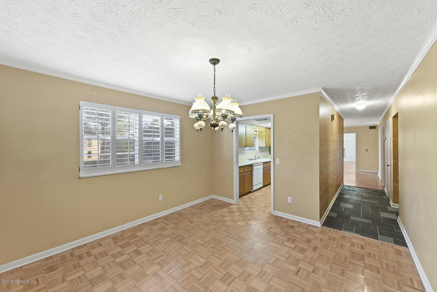 6511 Ferber Road Jacksonville, FL 32277 - Photo 9 of 27 a view of a livingroom with a chandelier fan and windows