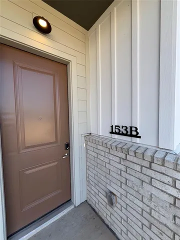 a view of house with swimming pool and outdoor seating