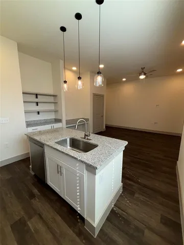 a view of kitchen with refrigerator and window