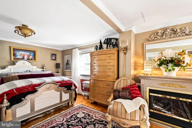 a bedroom with a bed and a fireplace