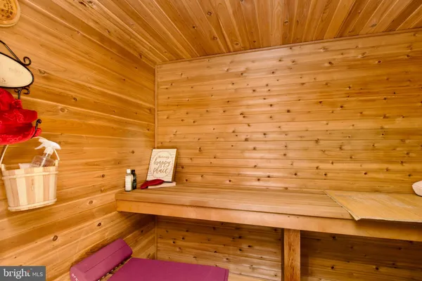 a bedroom with furniture and a rug