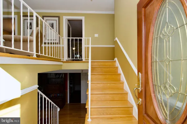 a kitchen with stainless steel appliances granite countertop a stove and cabinets