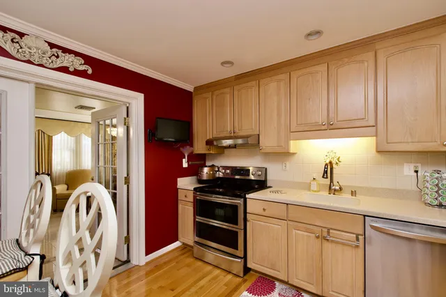 a kitchen with a sink cabinets and appliances