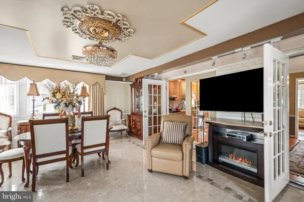 a livingroom with furniture and a flat screen tv