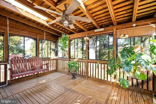 a view of a porch with wooden floor