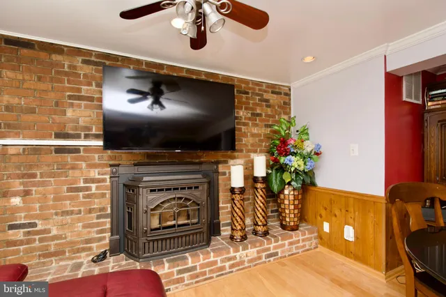 a living room with furniture windows and a fireplace