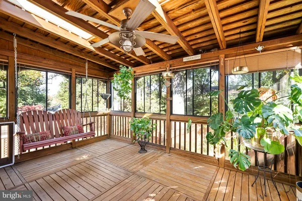 a view of a patio with table and chairs under an umbrella