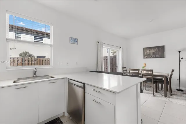 a view of a backyard with a table and chair