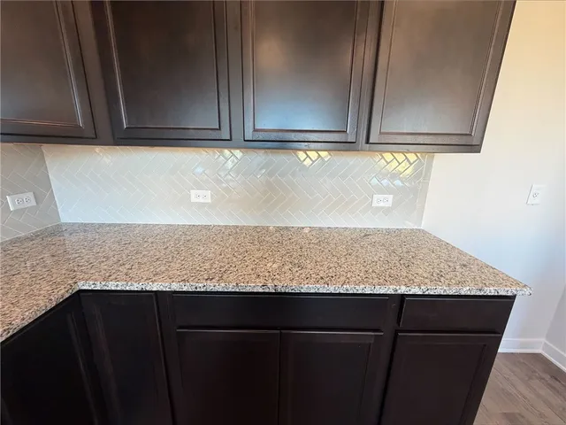 a view of a kitchen counter space and a sink