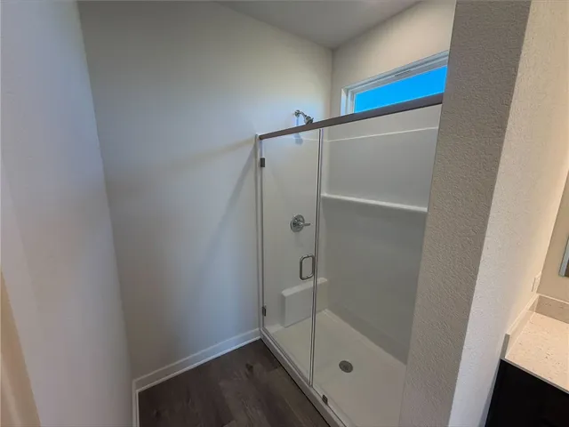 a room with a bed and a dresser