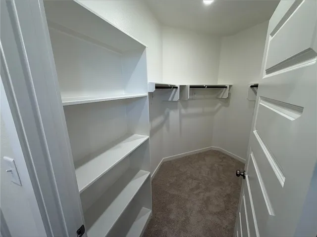 a bathroom with a double vanity sink and mirror