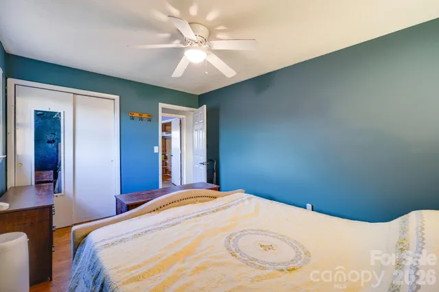 a bedroom with a bed and window