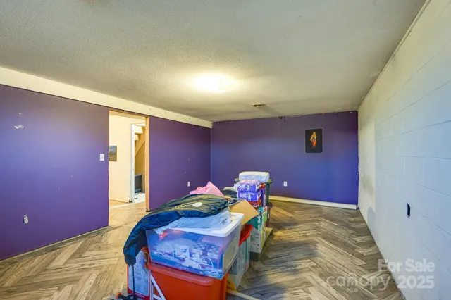 a bedroom with bed and a window