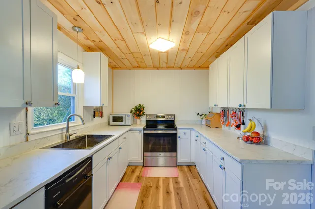 a kitchen with a sink and cabinets