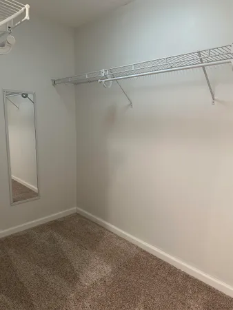 a bathroom with a double vanity sink toilet and shower