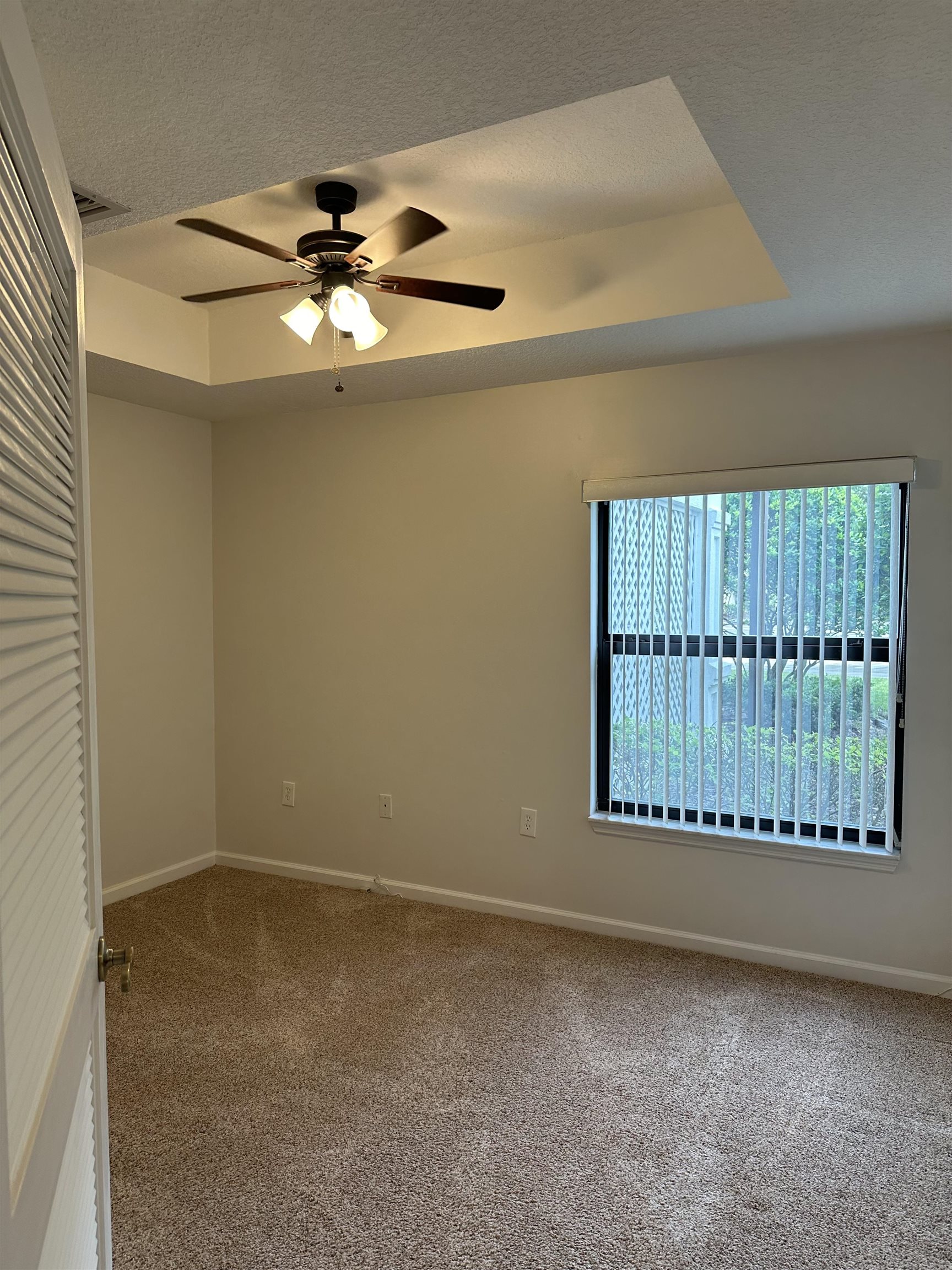 116 Laurel Wood Way, Unit 101 St. Augustine, FL 32086 - Photo 23 of 30 a view of an empty room with a window