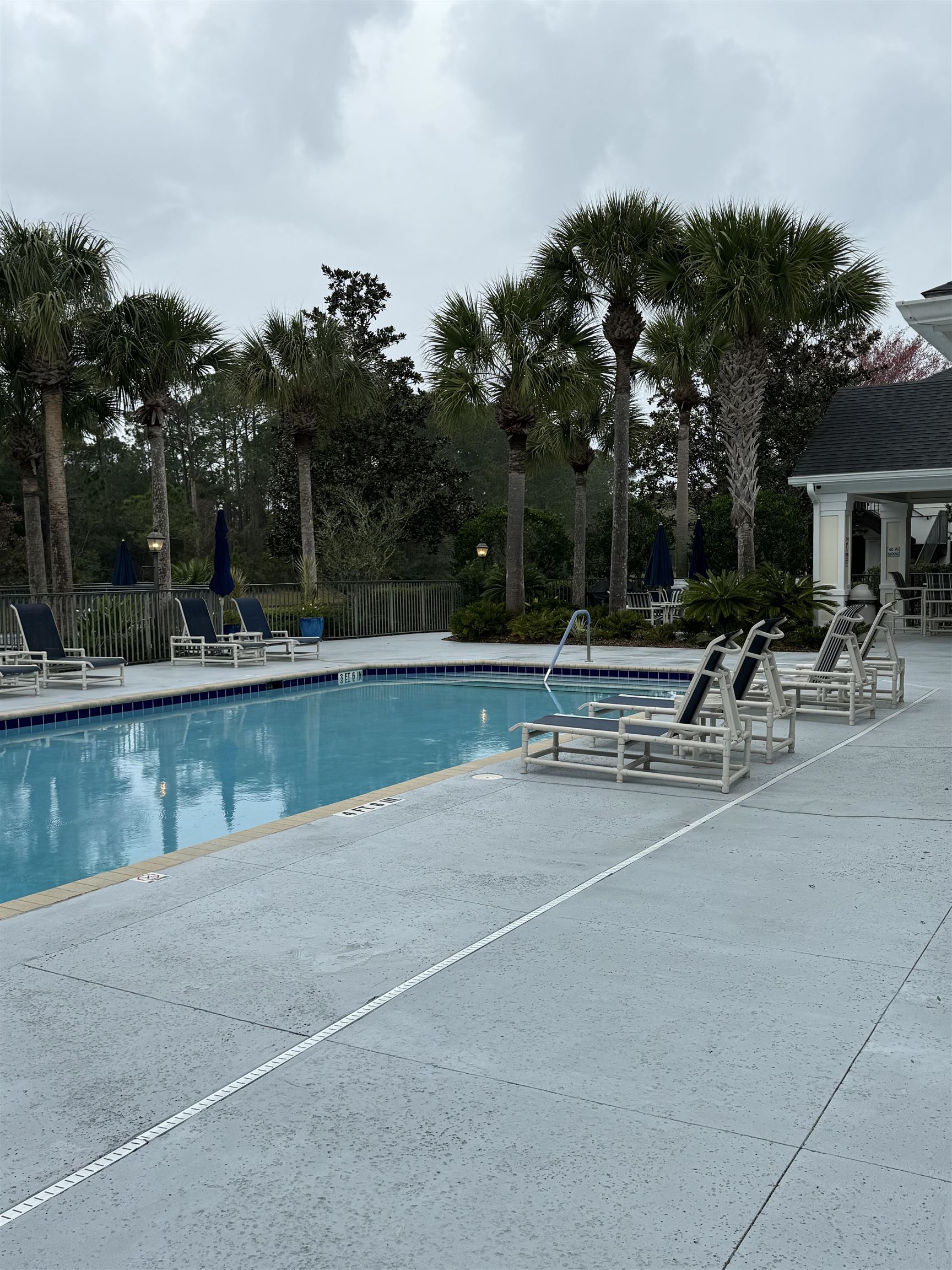 116 Laurel Wood Way, Unit 101 St. Augustine, FL 32086 - Photo 29 of 30 a view of swimming pool with outdoor seating and plants