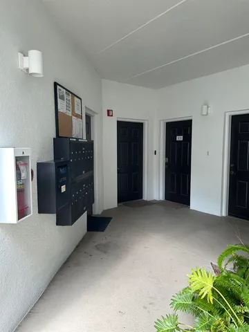 a view of workspace with cabinet and window