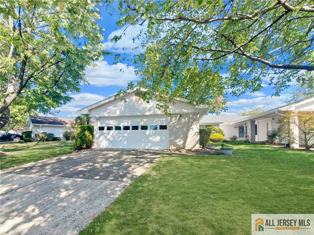742A Pompton Road, Unit A Monroe Township, NJ 08831 - Photo 1 of 23 a view of a house with a big yard and large trees