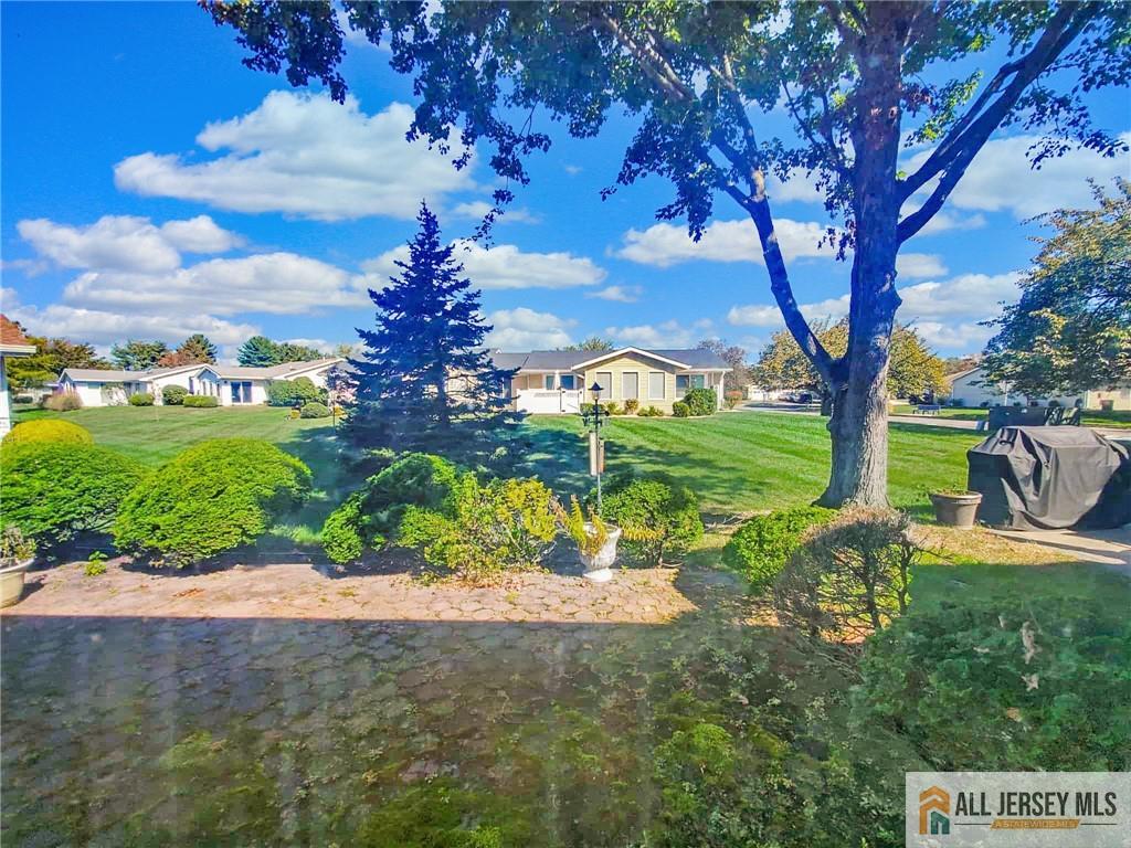 742A Pompton Road, Unit A Monroe Township, NJ 08831 - Photo 16 of 23 a view of a garden with a tree in front of the house
