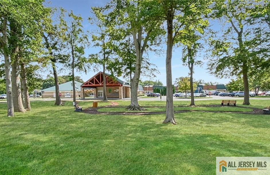 742A Pompton Road, Unit A Monroe Township, NJ 08831 - Photo 20 of 23 a swimming pool with lots of tress in front of it