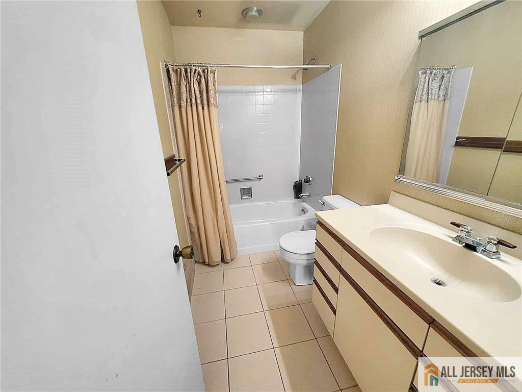 742A Pompton Road, Unit A Monroe Township, NJ 08831 - Photo 8 of 23 a bathroom with a sink a toilet a mirror and shower