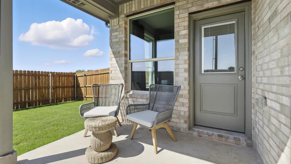 1909 Cherokee Lane Cleburne, TX 76033 - Photo 39 of 40 Patio - All Home and community information, including pricing, included features, terms, availability and amenities, are subject to change at any time without notice or obligation. All Drawings, pictures, photographs, video, square footages, floor plans, elevations, features, colors and sizes are approximate for illustration purposes only and will vary from the homes as built.