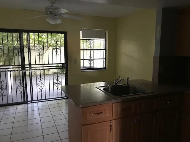 a kitchen with a sink and a window
