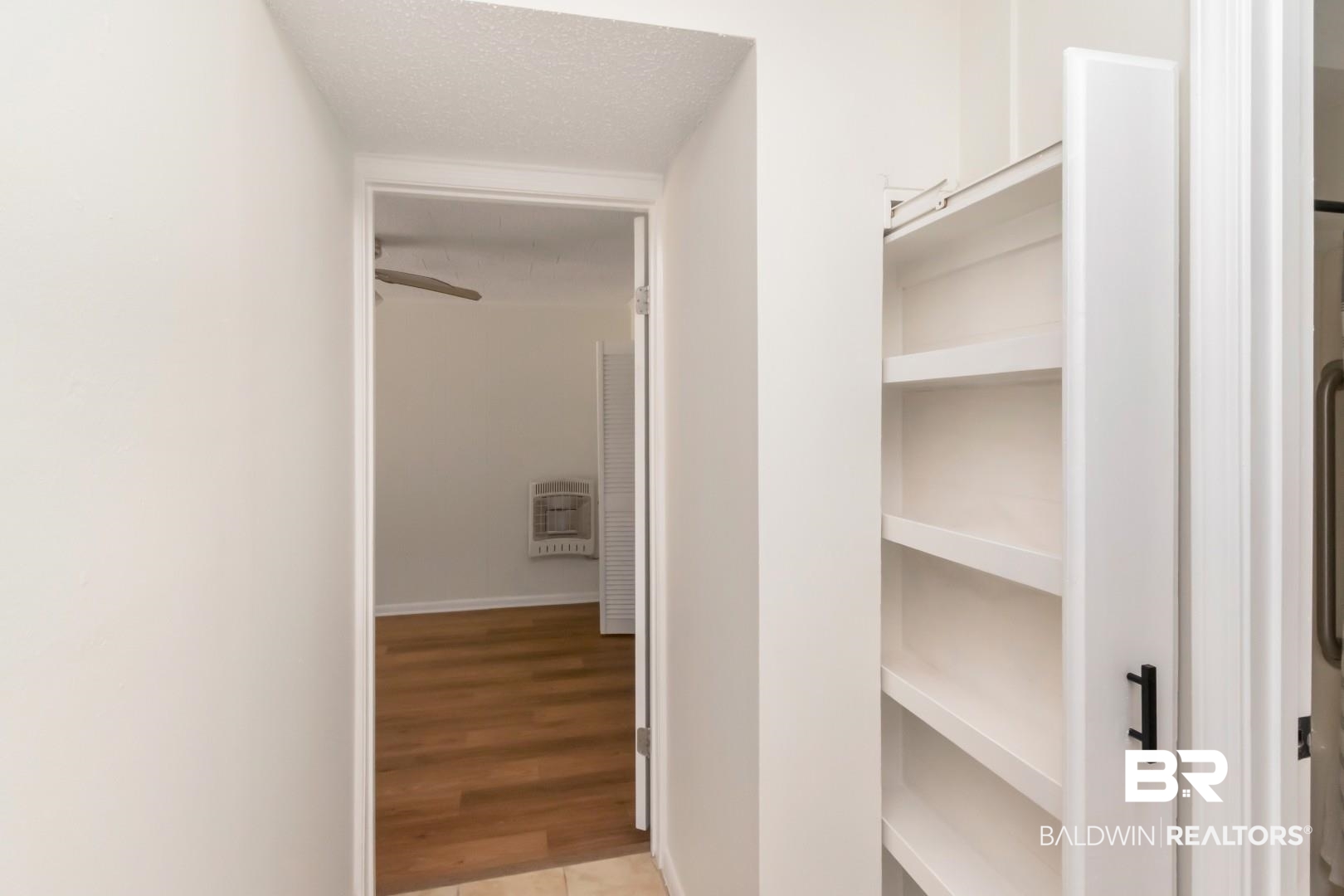 115 Pineridge Road Daphne, AL 36526 - Photo 20 of 34 Interior space with light wood-style floors, a textured ceiling, and heating unit