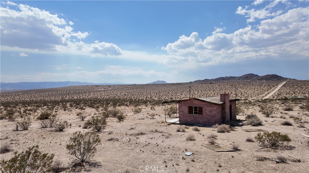 64494 Pole Line Road Joshua Tree, CA 92252 - Photo 1 of 1 a view of houses with sky view