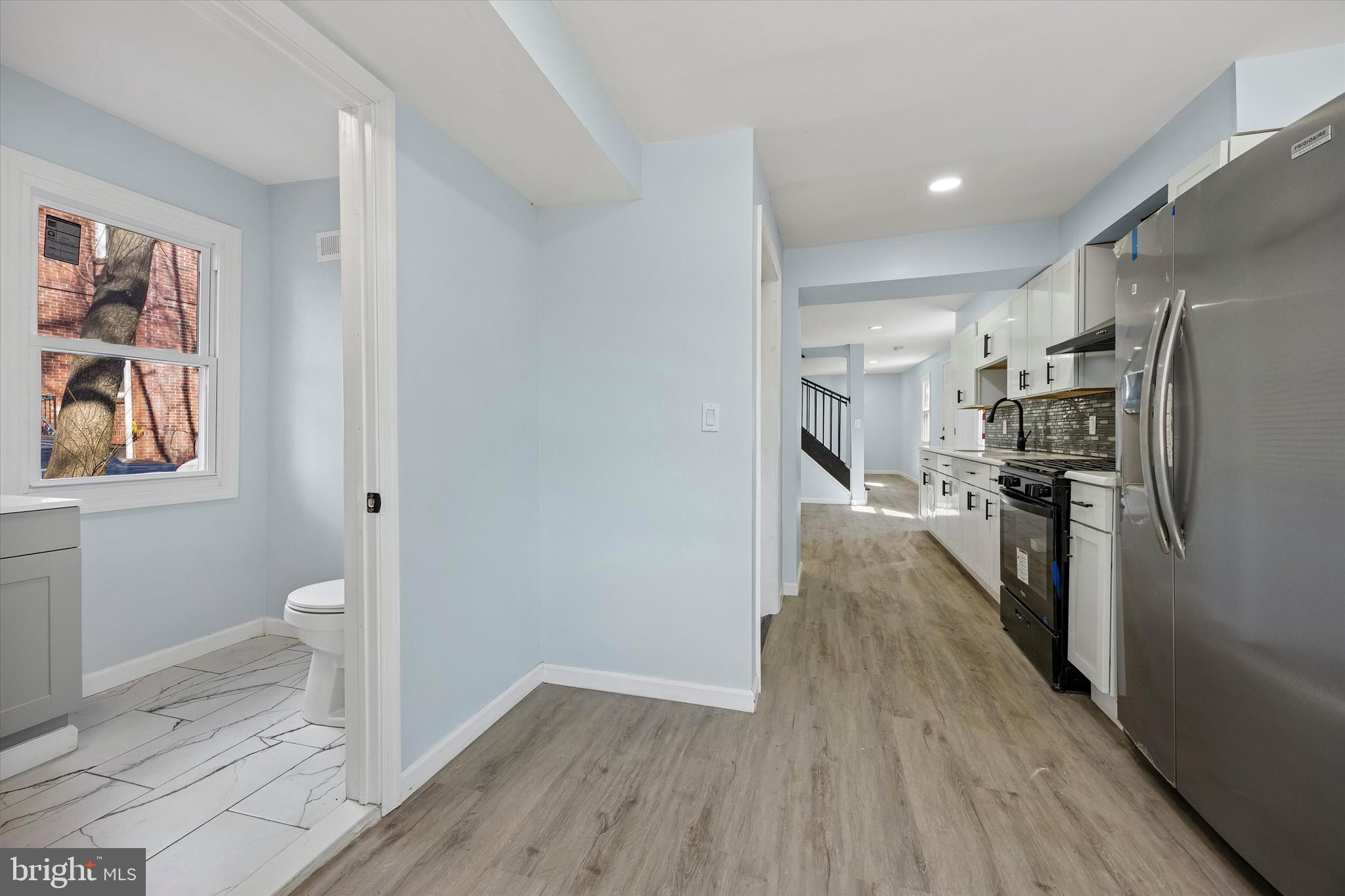 6 West Griffith Street Penns Grove, NJ 08069 - Photo 12 of 25 a kitchen with a refrigerator and wooden floor