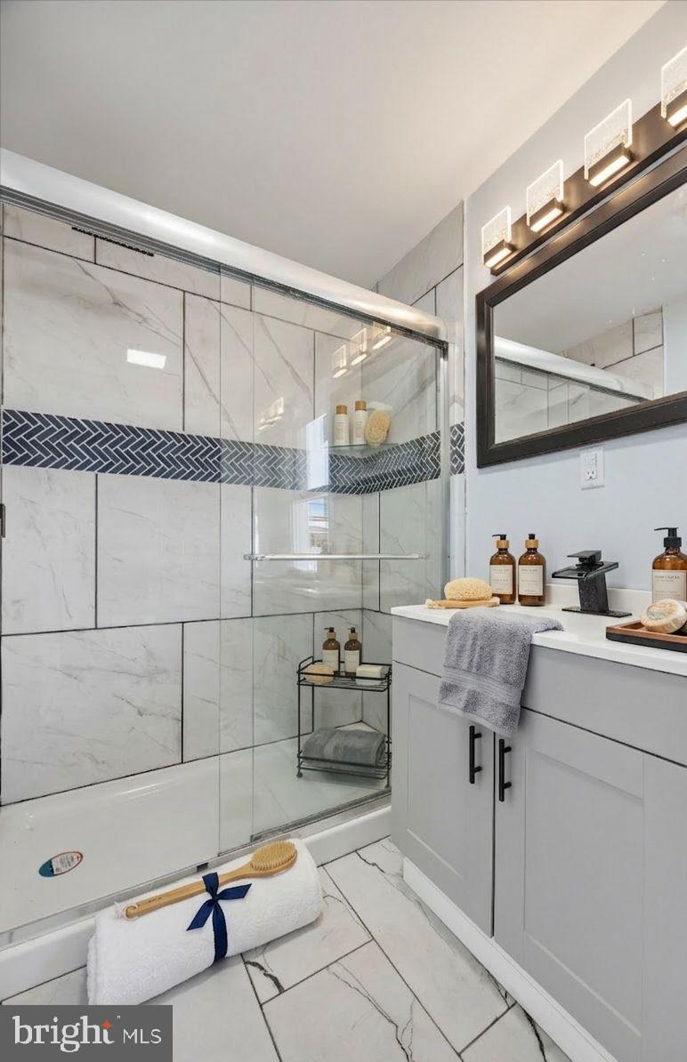 6 West Griffith Street Penns Grove, NJ 08069 - Photo 13 of 25 a bathroom with a sink and a mirror
