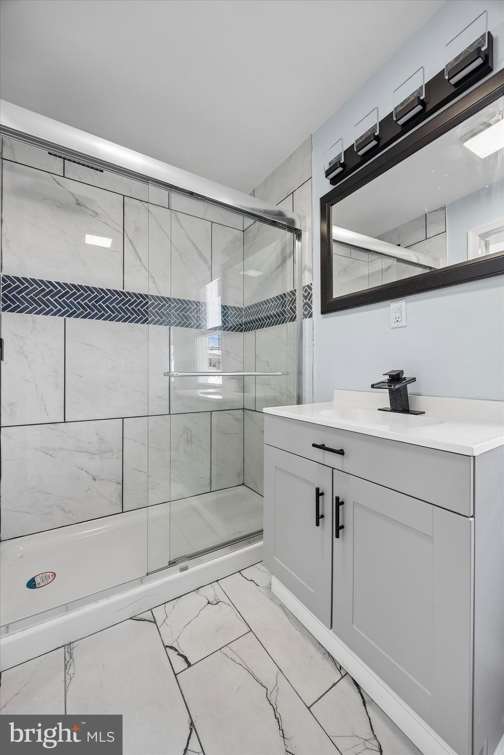 6 West Griffith Street Penns Grove, NJ 08069 - Photo 14 of 25 a bathroom with a shower and vanity