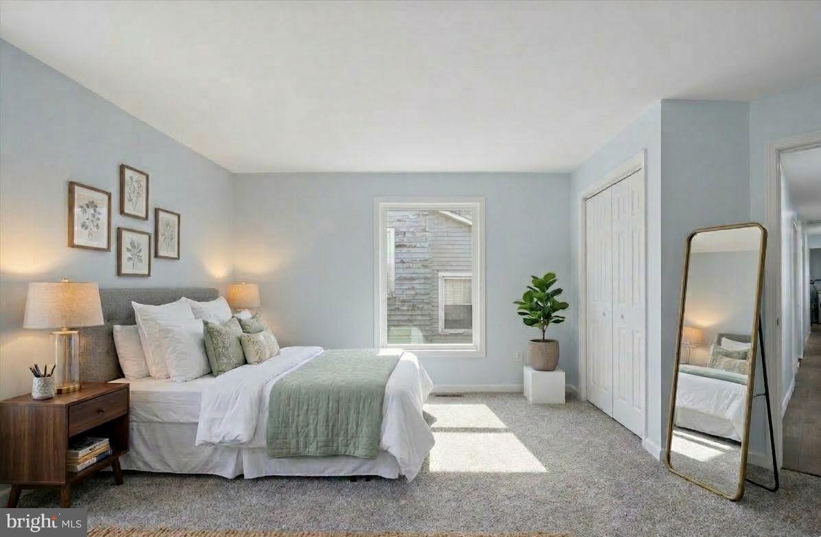 6 West Griffith Street Penns Grove, NJ 08069 - Photo 15 of 25 a bedroom with a bed and a potted plant