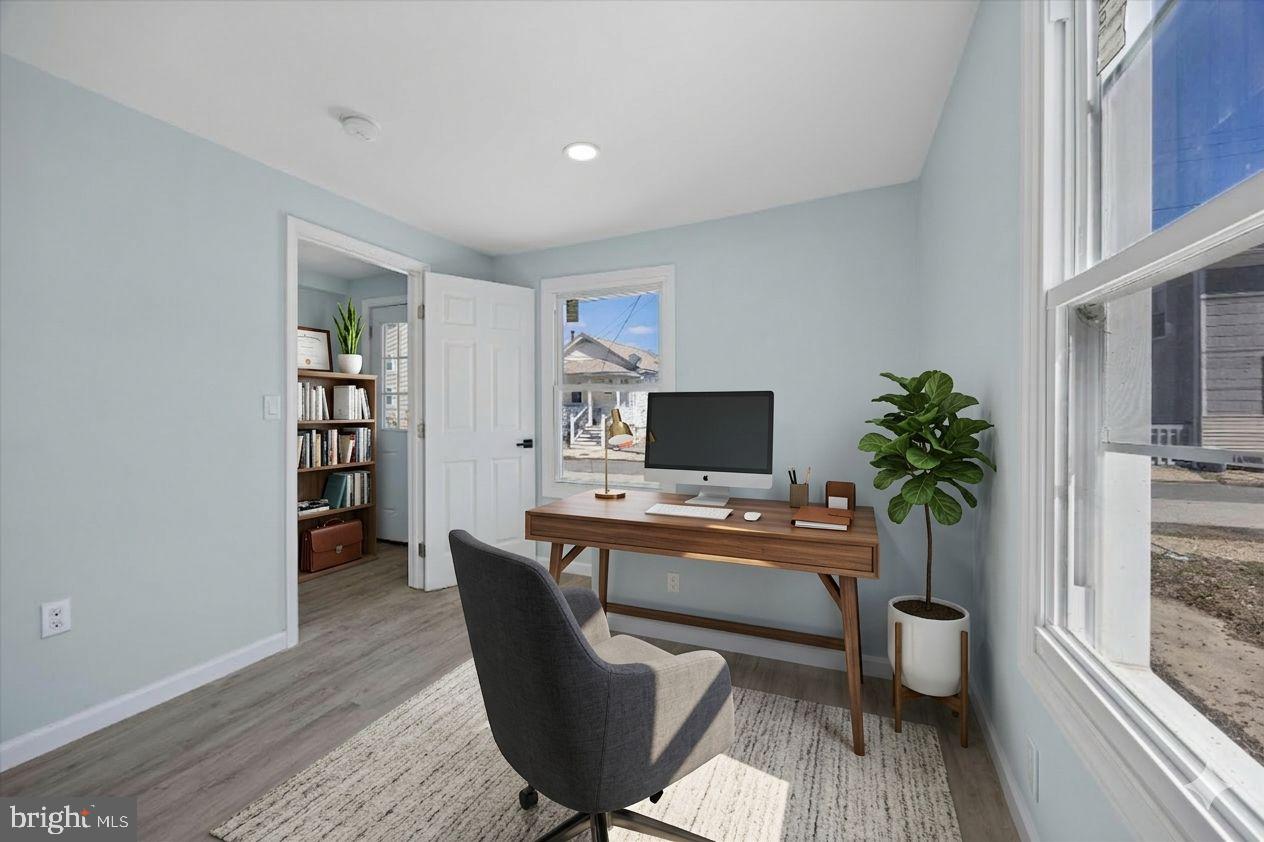 6 West Griffith Street Penns Grove, NJ 08069 - Photo 2 of 25 a workspace with furniture and a potted plant