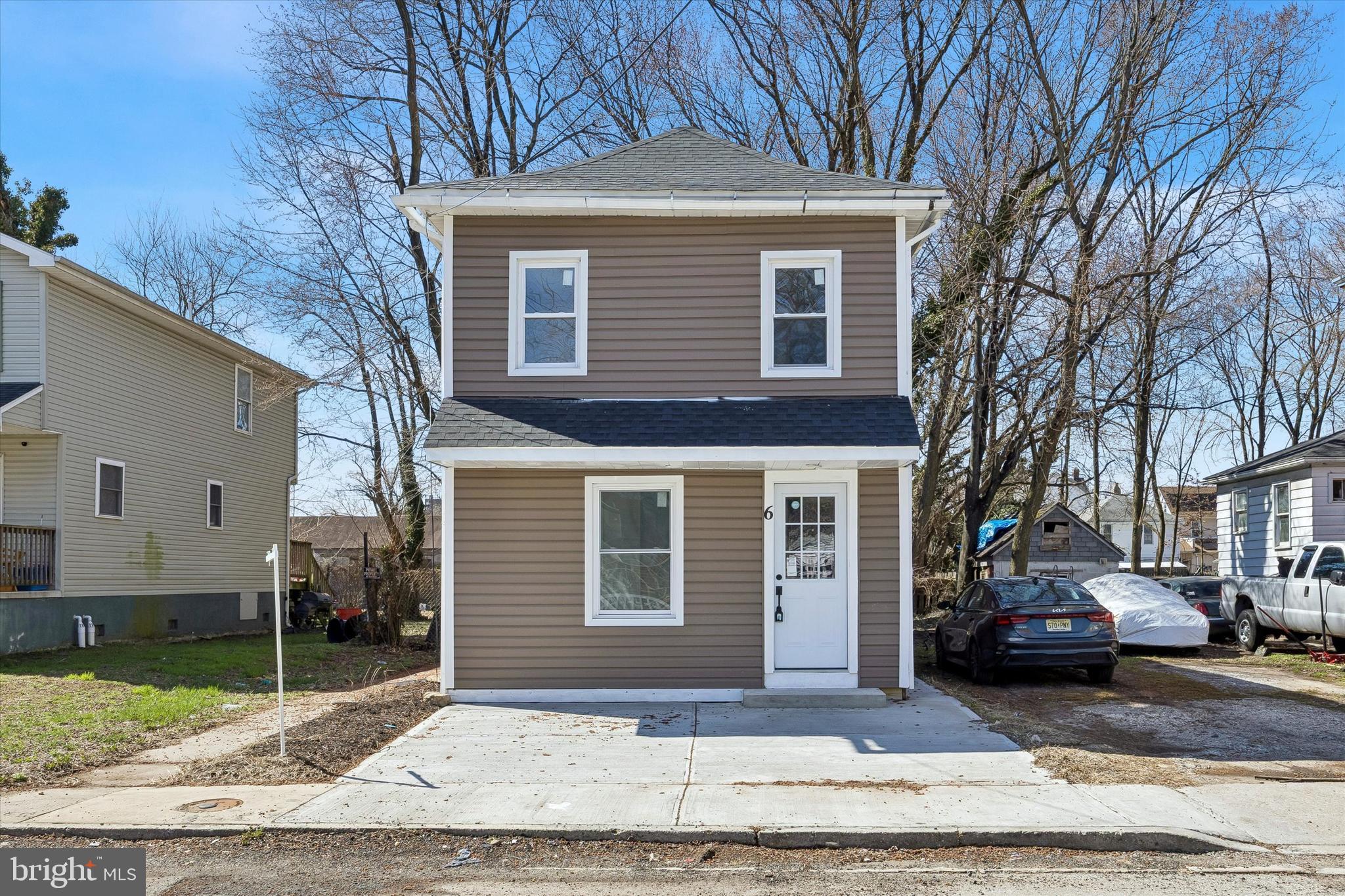 6 West Griffith Street Penns Grove, NJ 08069 - Photo 24 of 25 a front view of a house with a yard and garage
