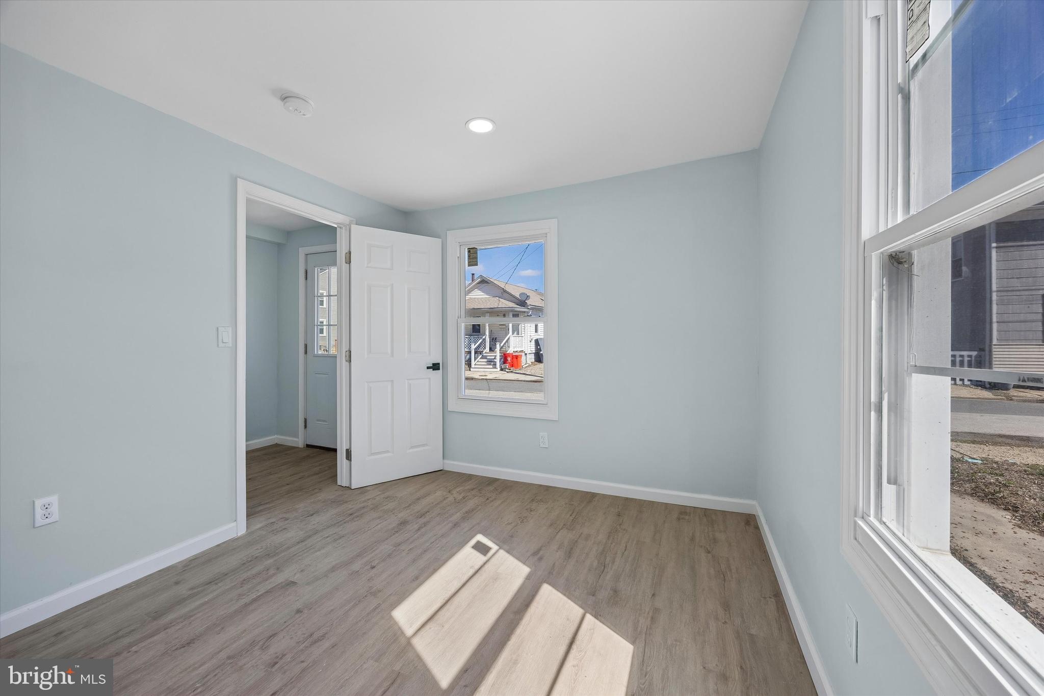 6 West Griffith Street Penns Grove, NJ 08069 - Photo 3 of 25 a view of hallway with a large window and wooden floor