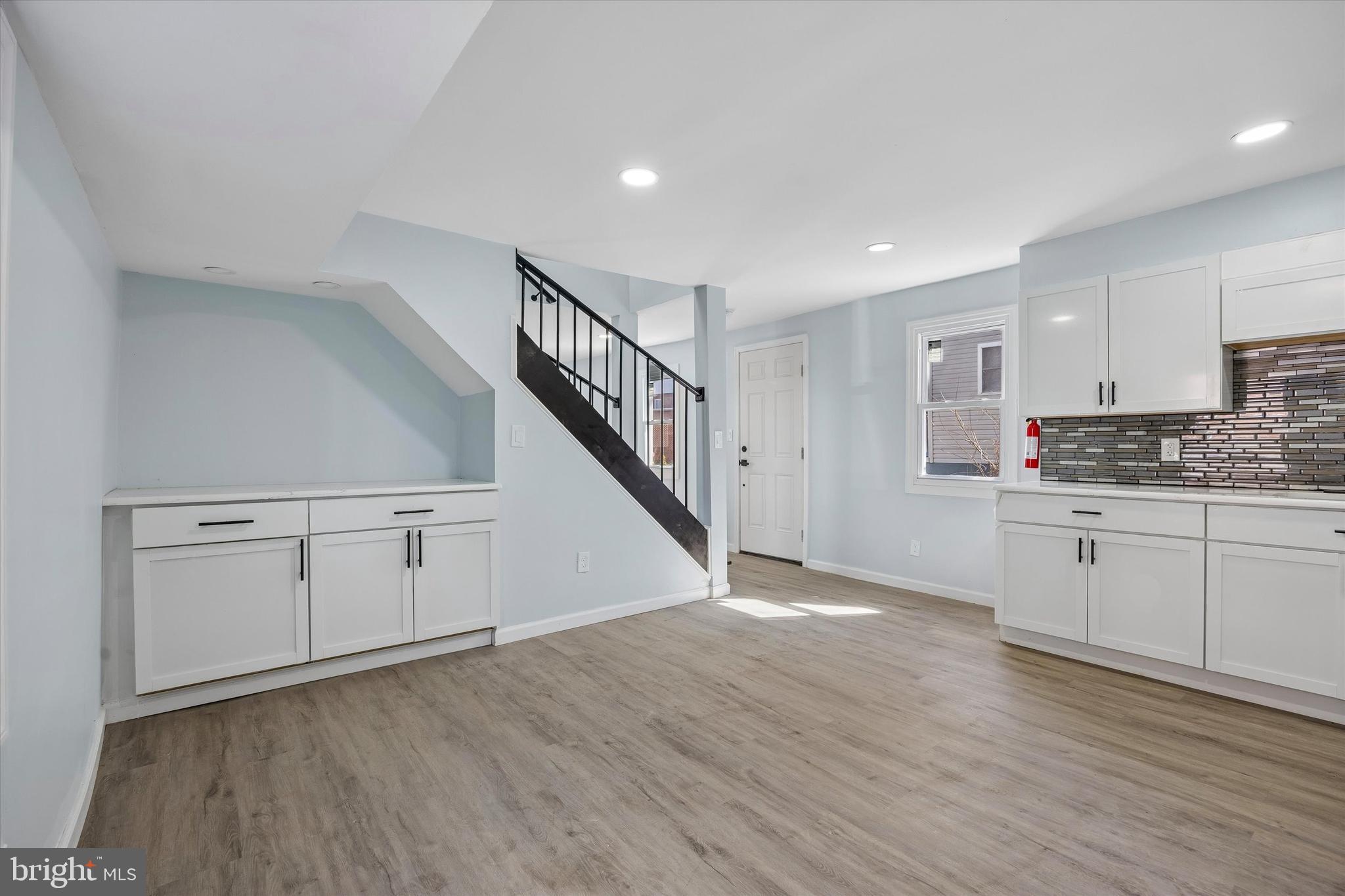 6 West Griffith Street Penns Grove, NJ 08069 - Photo 9 of 25 a view of a kitchen with wooden floor and electronic appliances