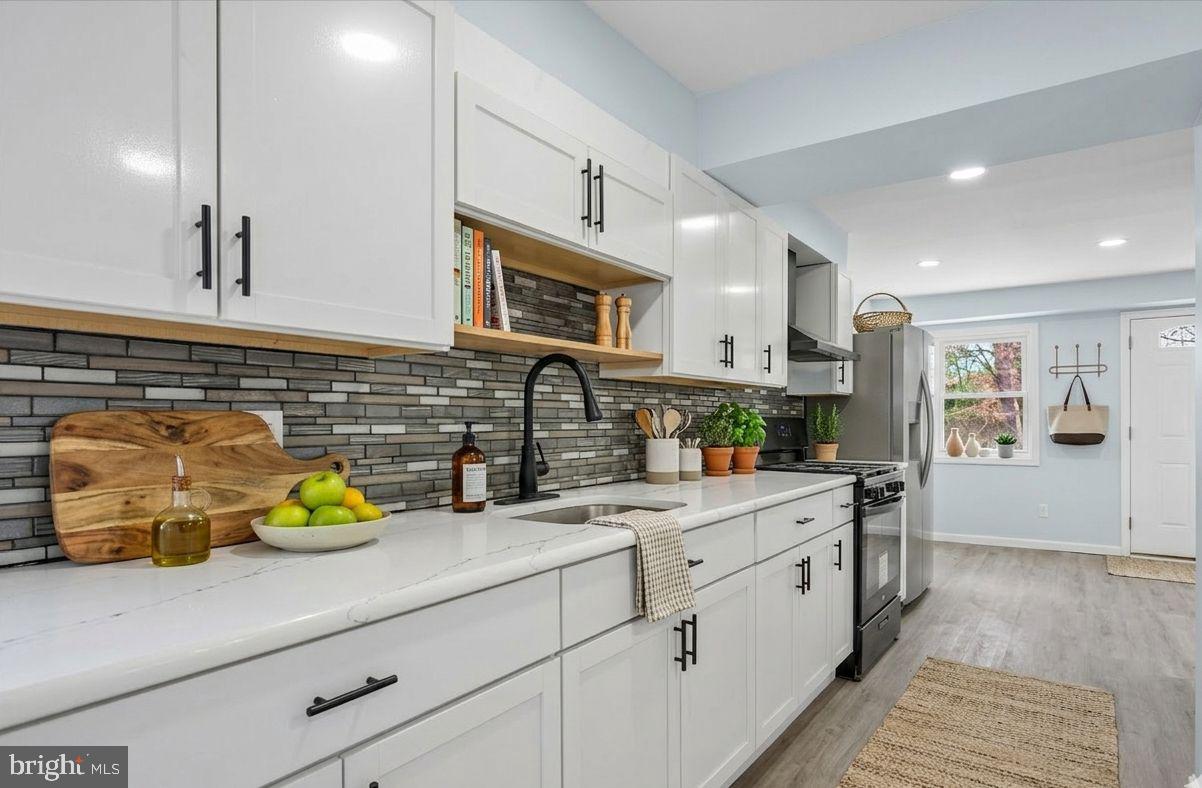 6 West Griffith Street Penns Grove, NJ 08069 - Photo 10 of 25 a kitchen with a sink white cabinets and appliances